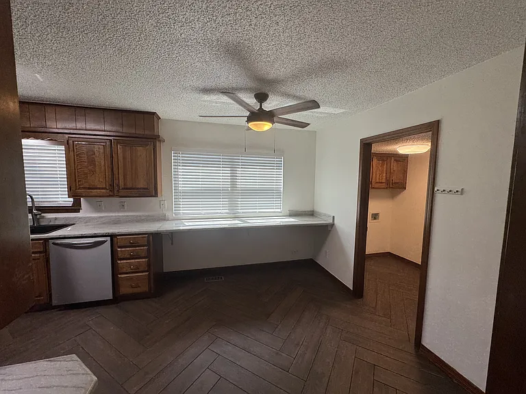 Entering the kitchen, Tons of counter space, door to laundry room on right.