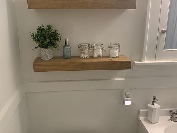 Bathroom shelves included