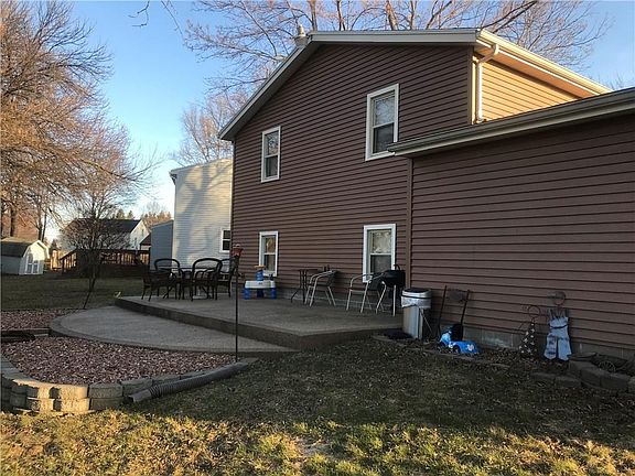 EXTERIOR REAR WITH POURED CONCREATE PATIO