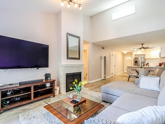 Beautiful fully furnished family room with 65 inch flat screen TV.