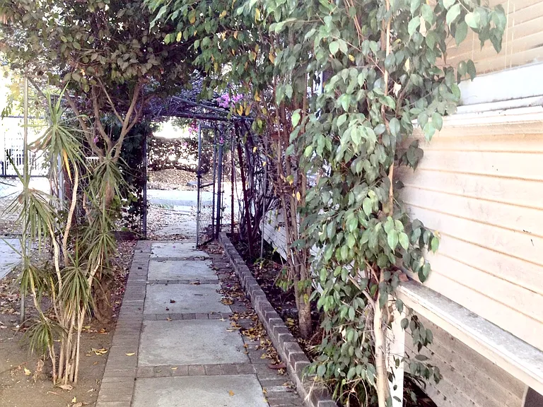 Charming vine-covered walkway at USC student residence - secure gated access in North University Park