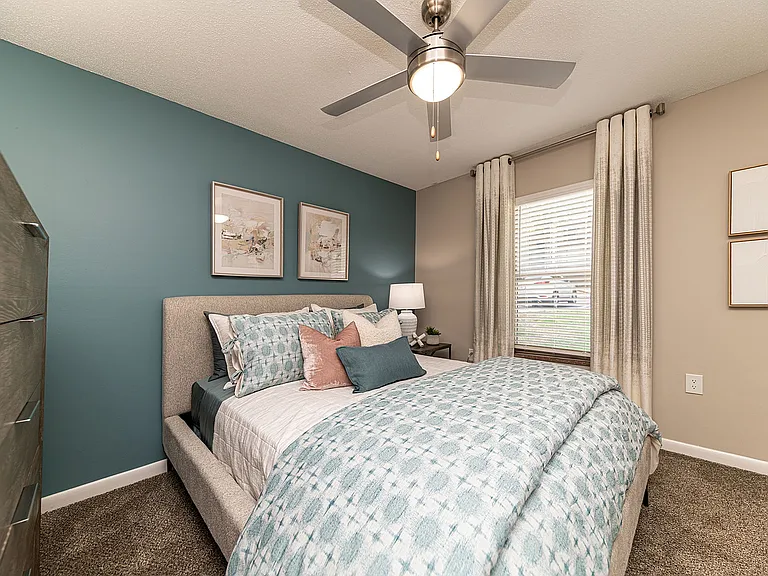 Bedroom with carpet & ceiling fan