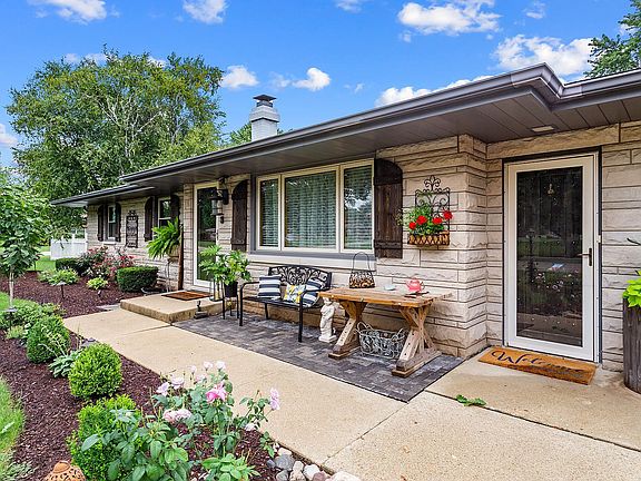 The front porch has a paver sitting area and is beautifully landscaped.  A separate entrance to the 