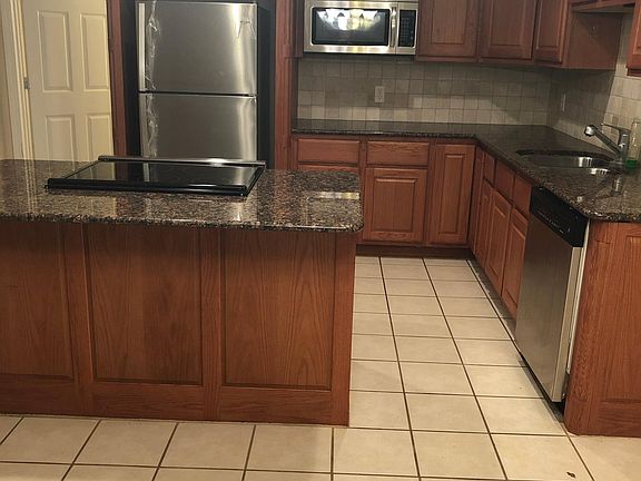 Remodeled open concept kitchen with new appliances.