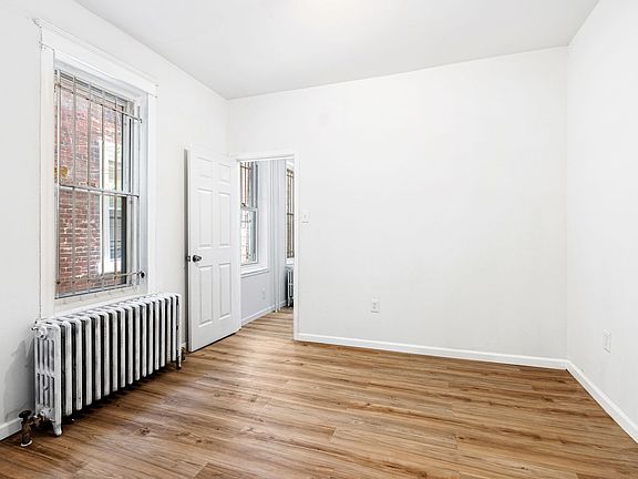 Bedroom with hardwood floors.