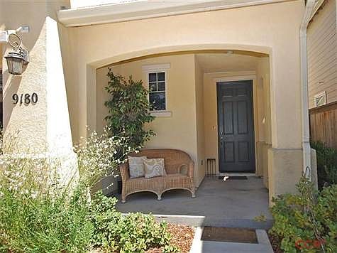 Inviting front porch. Front landscaped is maintained by community association.