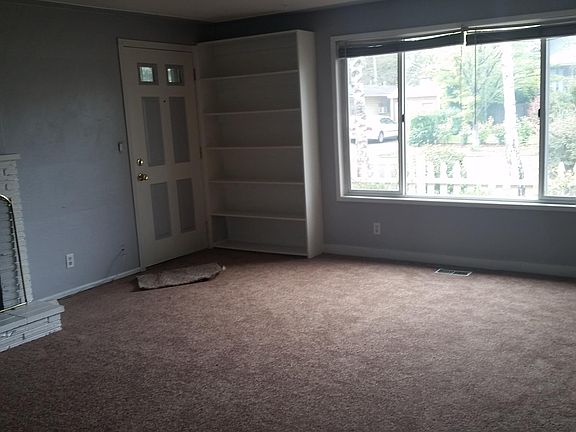 Living room with old carpets. Soon will post pictures with beautiful new floors and new vertical blinds