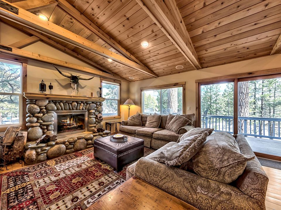 Hickory wood floors in living, dining , kitchen area. Vaulted ceilings in upper floor