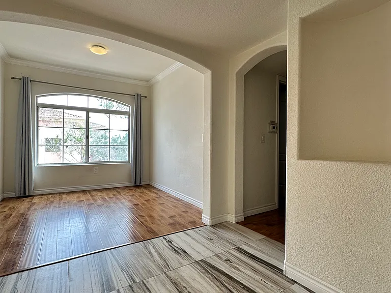 Hallway that leads to the second bathroom and bedroom.