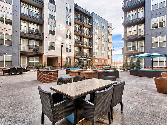 The courtyard features a fire pit
