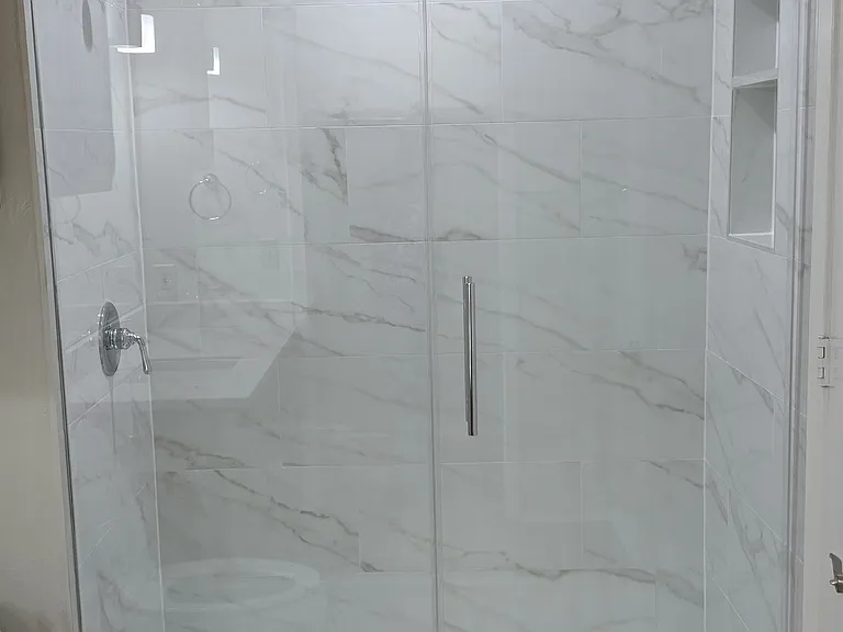 master bathroom features new shower, tile enclosure and new glass door