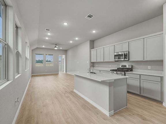 Kitchen in the Cedar home plan by Trophy Signature Homes - REPRESENTATIVE PHOTO