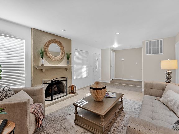 Bright and airy living area right as you enter townhome. CARPET HAS BEEN REPLACED BY HARDWOOD PLANKS.