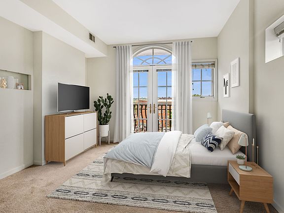 Bedroom with balcony (virtually staged)