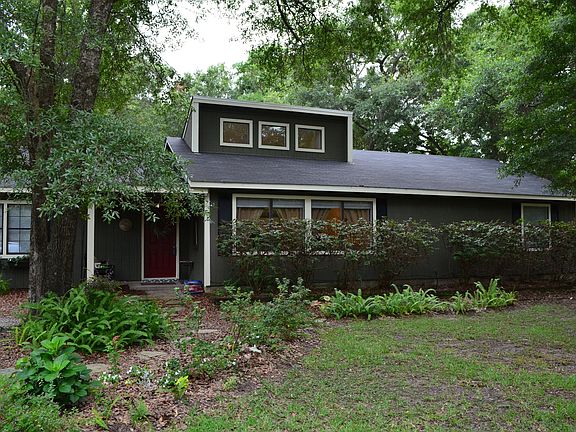 House with azaleas cut back