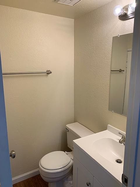 Half bath downstairs, also has individual water heater in closet