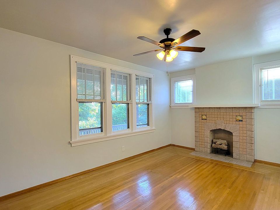 Living Room featuring original Rookwood Fireplace!