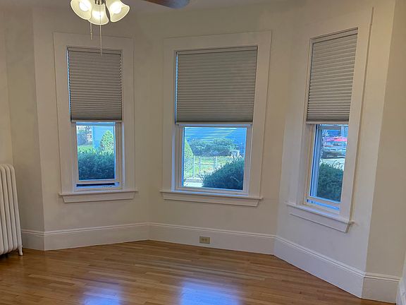 FRONT BEDROOM
New ceiling fan
4 new windows
New off white push up blinds from Blinds-to-Go
Refinished hardwood floor