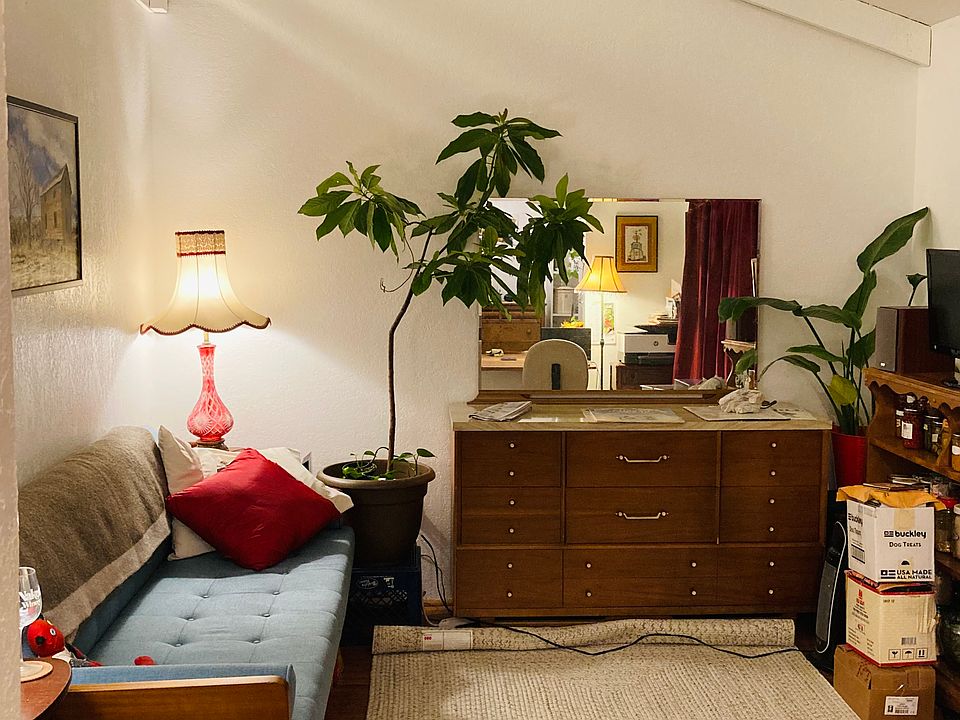 Living room with sleeping loft above