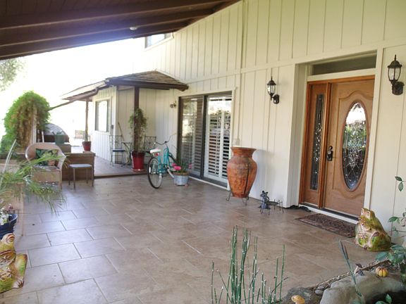 Front Entrance, tiled patio, pond