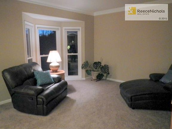 Formal living room with bayed window office also has new paint &