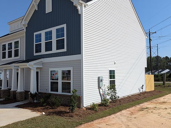 Right side of building. Street parking available just to the right of home.