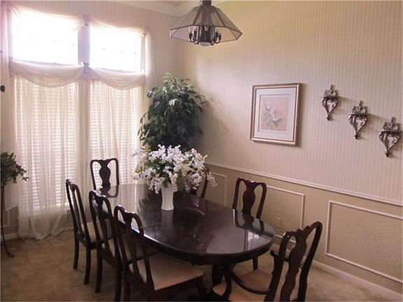  FORMAL DINING ROOM WITH WAYNESCOATING AND NATUAL LIGHTING