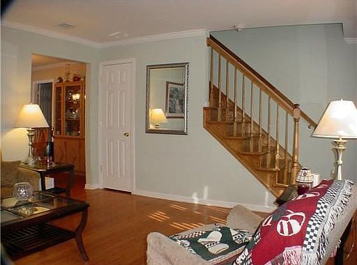 Part of living room showing steps going to 2nd floor