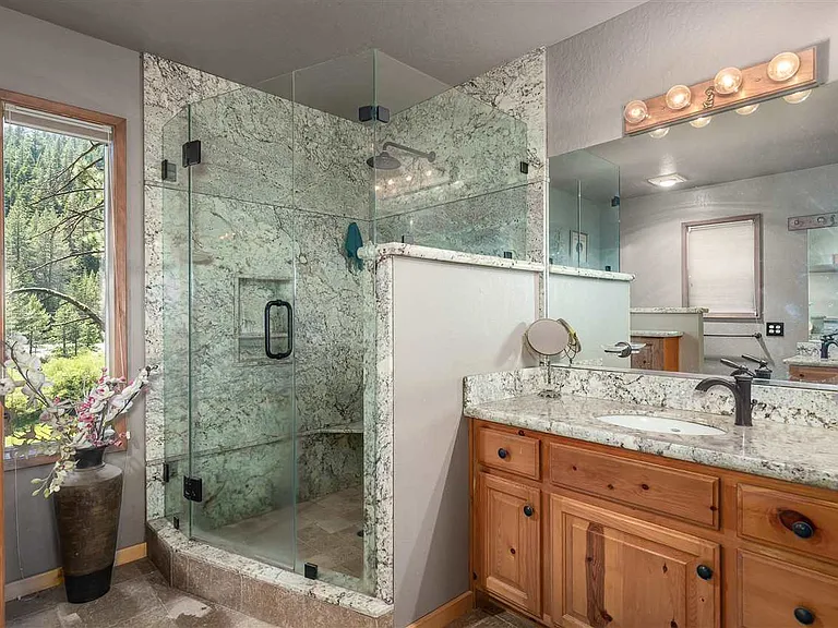 Updated primary bathroom with walk-in shower