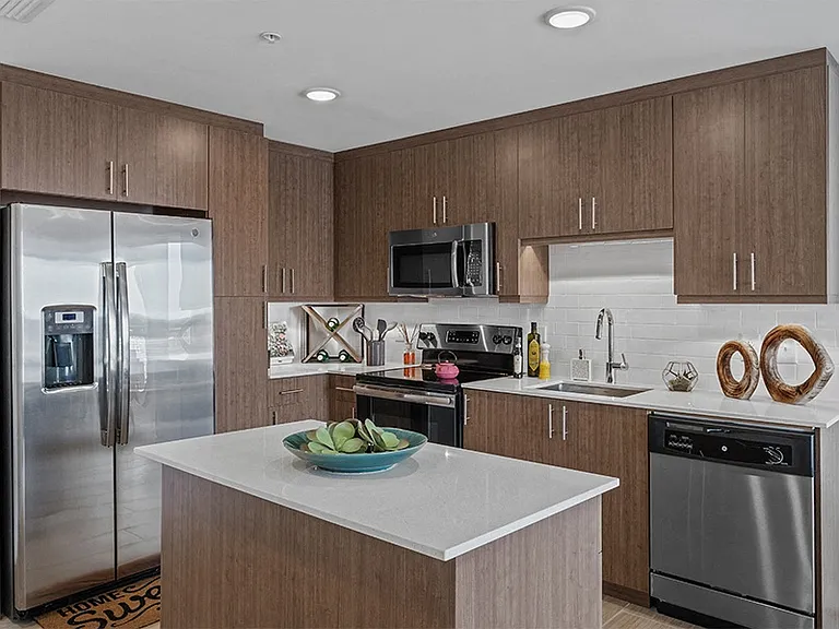 Homes include contemporary kitchens with islands and stainless steel appliances