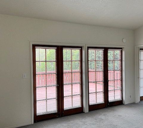 Living Room with French Doors Accessing Deck