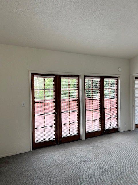 Living Room with French Doors Accessing Deck