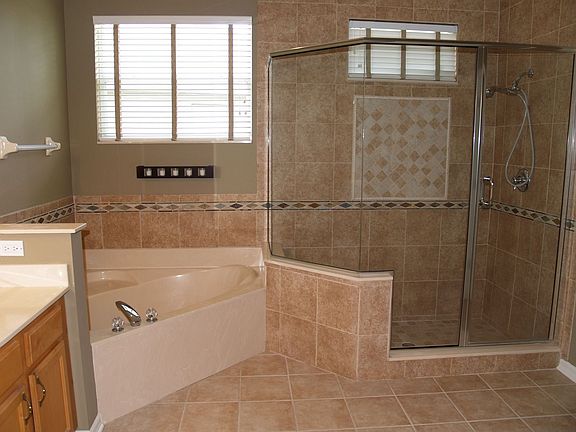 plus an atrium styled garden tub and oversized glass-walled shower. Beautiful!