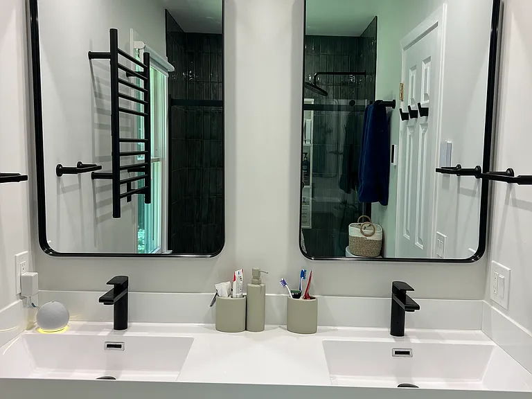 Double sink in the second full bath which also has heated floors.