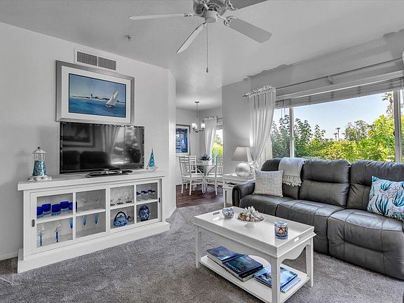 Living room with lake and pool views