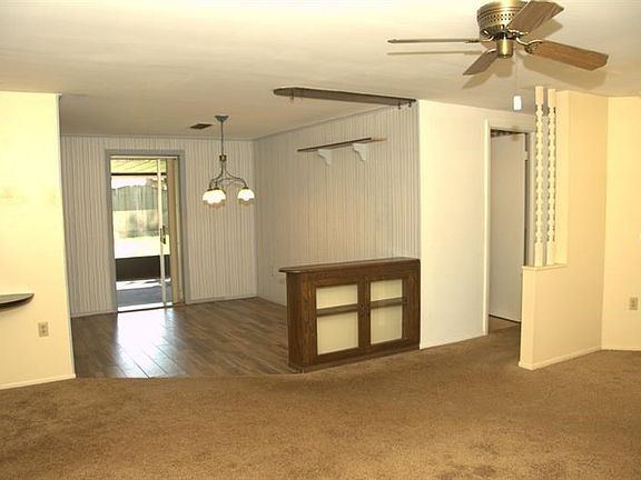 From the living room you're looking at the dining room and door out into the patio.  The hall way on the right goes to 2 bedrooms and the bathrooms.