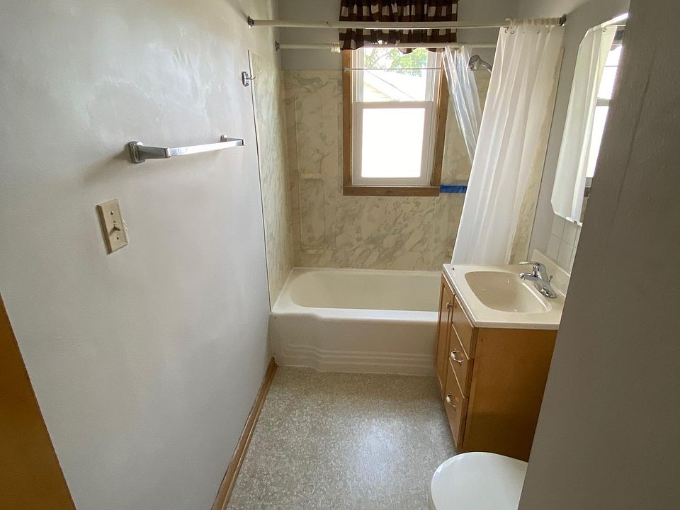 Spacious bathroom with large linen closet.