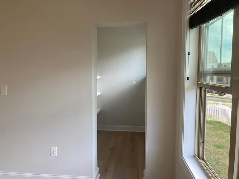 Kitchen nook leads into pantry