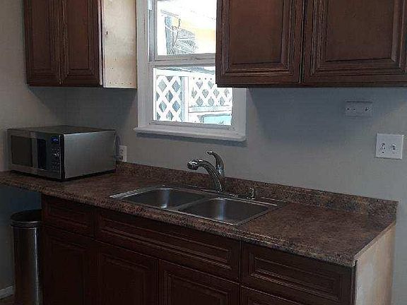 kitchen with window and door to back patio