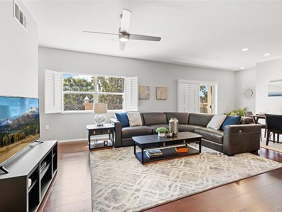 Bright living room with plantation shutters.
