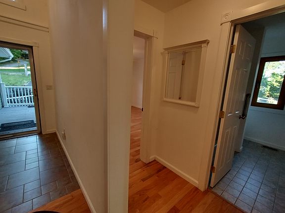 View of front door. Private Hallway to guest quarters, Second large Bedroom and Second large full bath