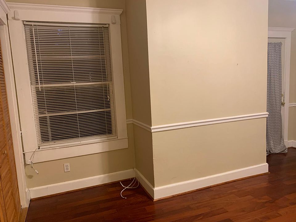 Bedroom with window 2/2 and view of back balcony door