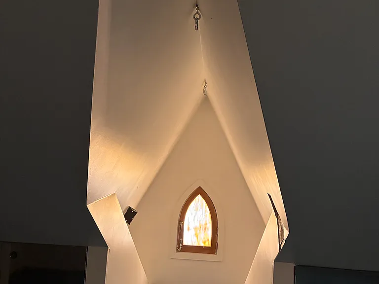 Lovely little window in the attic. The attic is a large space with 8 foot ceilings at many points. It is perfect as a second bedroom or an office or a child's playroom.