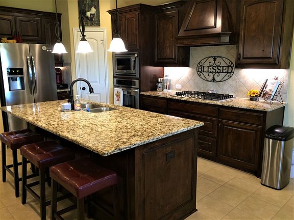 Large island, wood cabinets