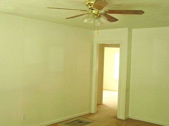 View from the living room into the hallway to the bedrooms