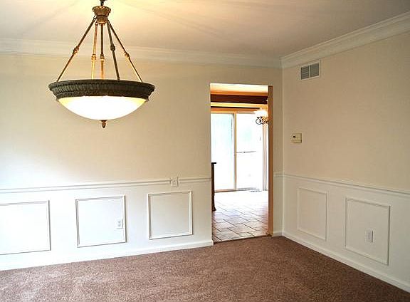 Dining Room with wainscoting & crown moulding