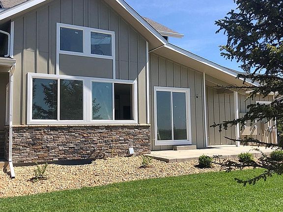 Side patio and a lot of windows.