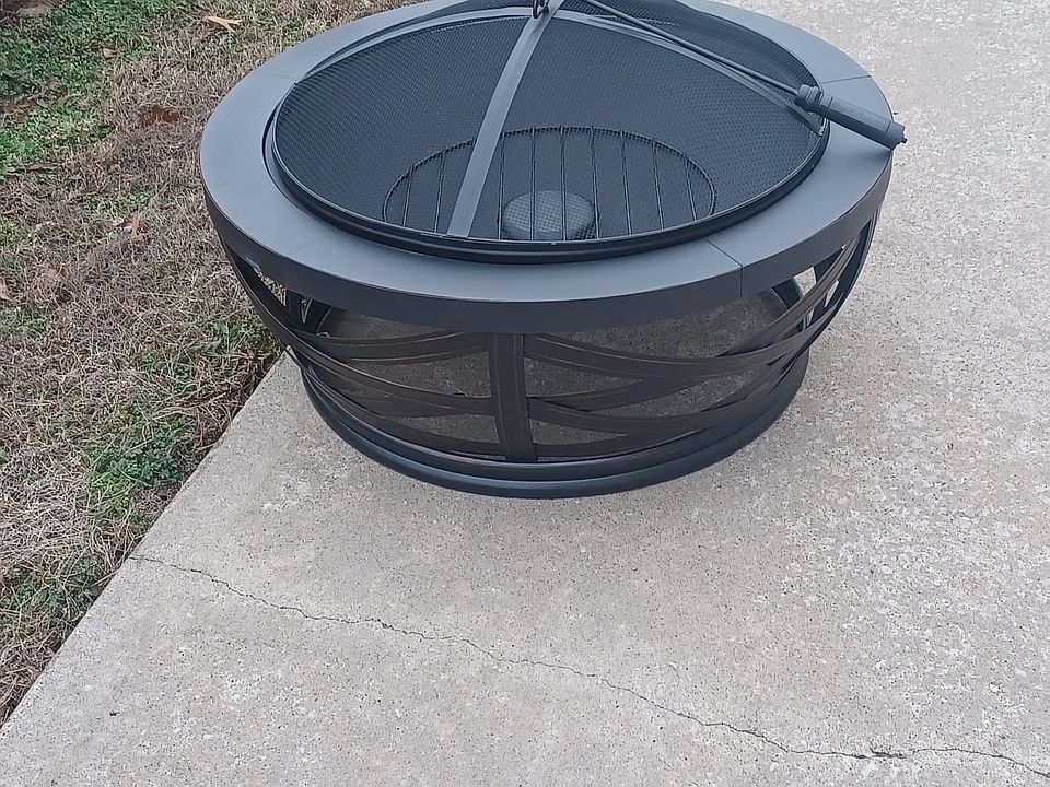 Fire pit and firewood stack provided