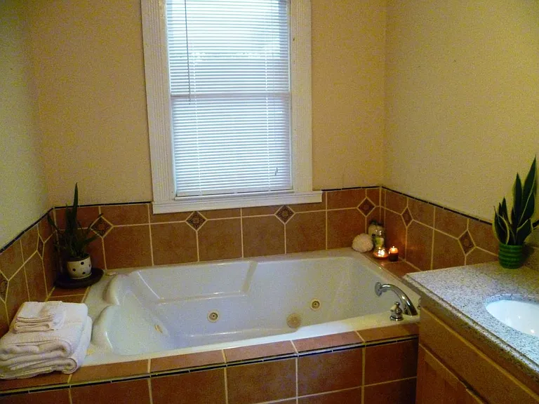 The largest indoor, jetted tub you'll ever see. Designed for two adults to comfortably lay back, side-by-side.
