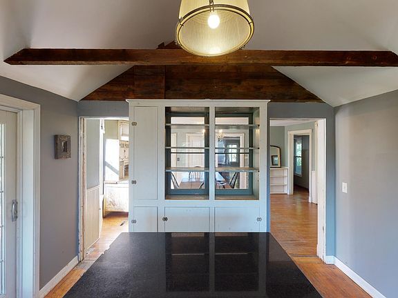 Kitchen adjoins large dining room. House boasts numerous built in bookshelves.